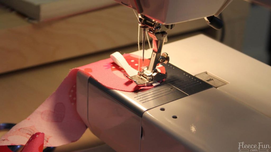Finishing the apron ties with reinforced stitching for extra durability
