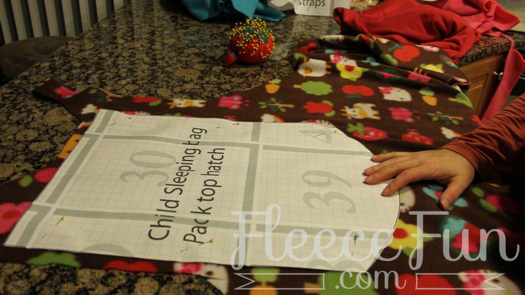 cutting the fabric. I love this sleeping bag pack that turns into a backpack! It's a free sewing pattern and there is a video to make it easy! This sleeping bag pack how to is a great DIY sewing project.
