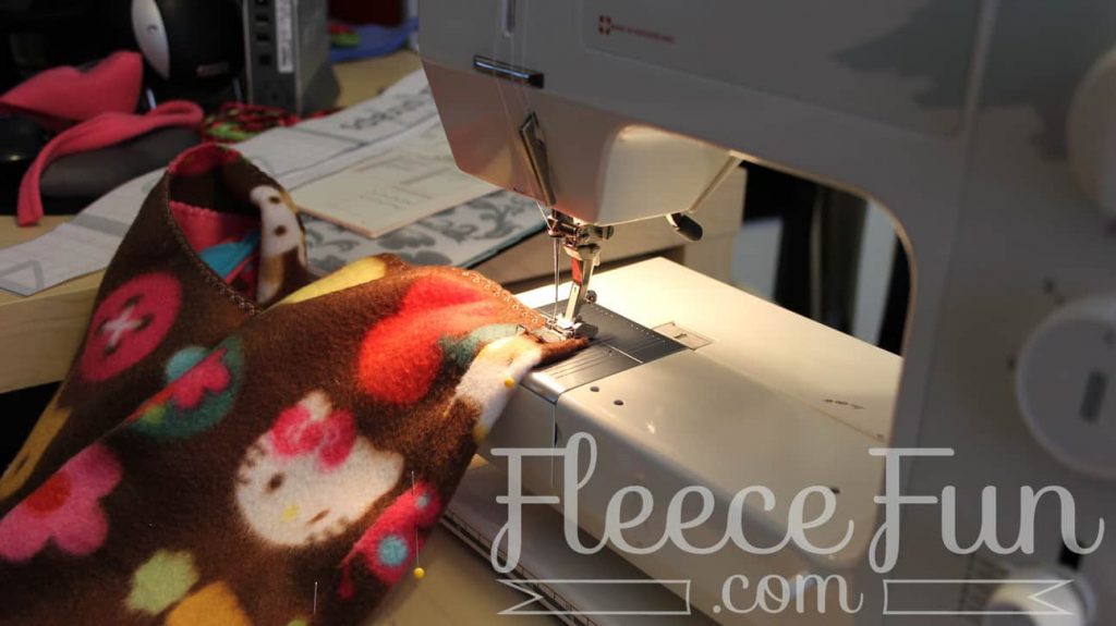 preparing the sleeping back pack for mounting. I love this sleeping bag pack that turns into a backpack! It's a free sewing pattern and there is a video to make it easy! This sleeping bag pack how to is a great DIY sewing project.