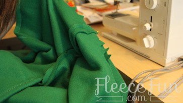 Lining up the triangles with the right sides together.