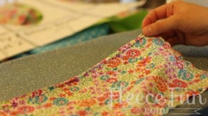 Pinning fabric pieces together to start sewing a DIY apron