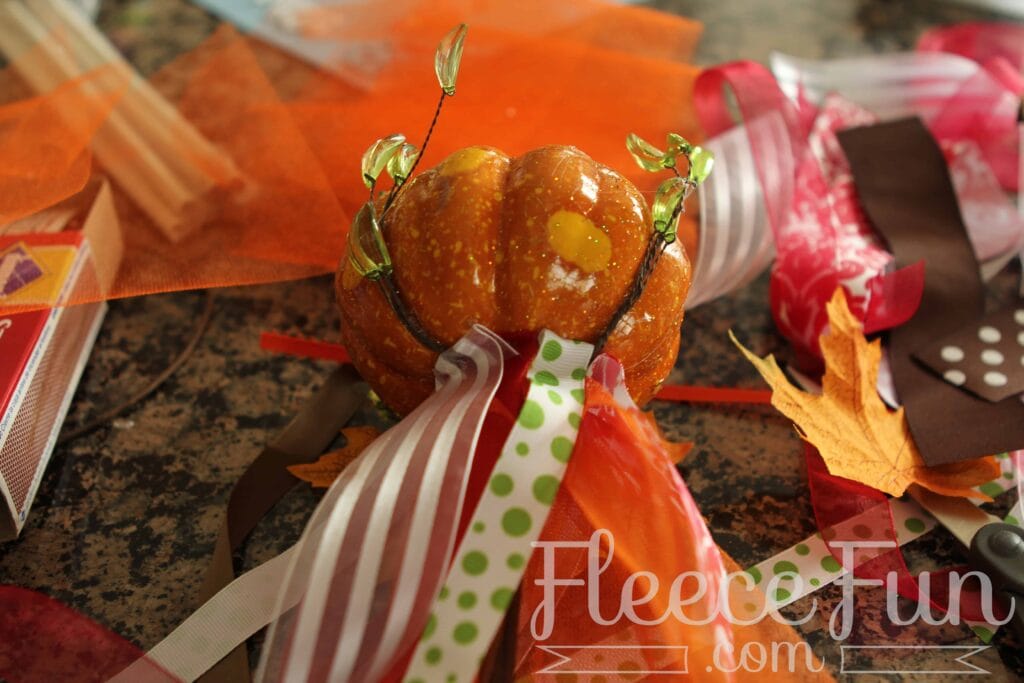 Fall Fairies_092312_1168 Add tulle around the base of the pumpkin of the fairy wand.
