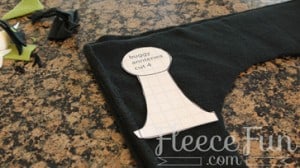Cutting out the ladybug hat pattern pieces for the fleece hat tutorial