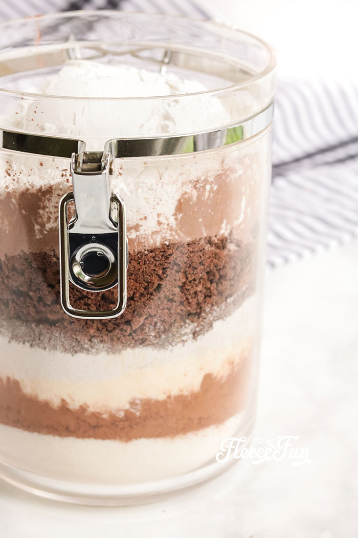 Ultimate homemade hot chocolate mix in a jar displayed with fleecefun and free template and tutorial.