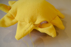 Stuffing the softie. a sunshine softie, perfect for kids, handmade gifts, and DIY sewing projects, made with free pattern and step by step tutorial from fleece fun