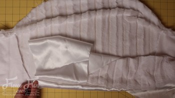 lining the jacket. I love this cute Frozen inspired Elsa cape. tutorial it's a jacket and cape fit for a queen. The cold might not have bothered Elsa, but it might bother my little one while trick or treating and this is perfect. Love this sewing costume DIY with free pattern.