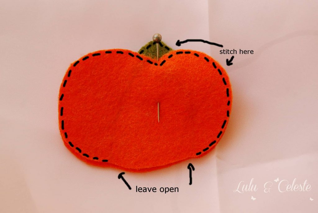 Sewing the pumpkin edges.
