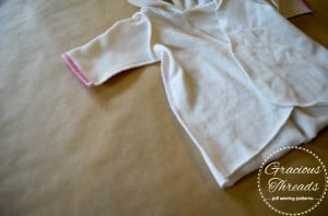 Sewing one underarm. 