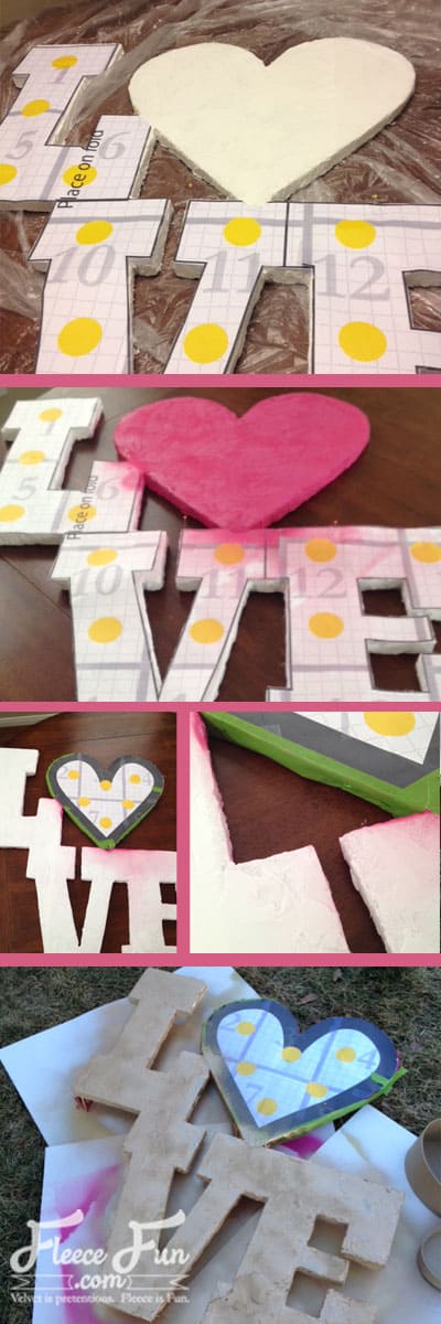 Painting DIY giant love letters with vibrant colors using fleecefun's free Valentine tutorial.