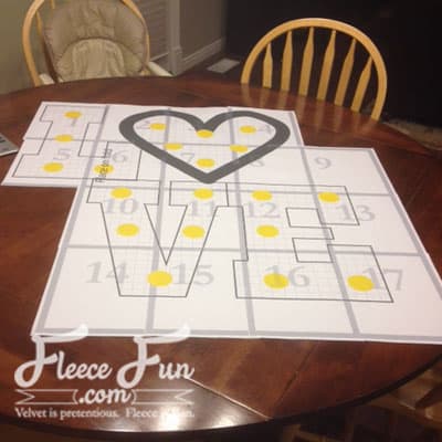 Preparing the giant love letter pattern using fleecefun's free template and tutorial for perfect assembly.