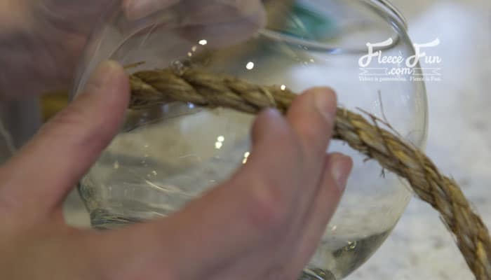 gluing the rope to the bowl. I love these pirate centerpieces. These are a perfect pirate party DIY idea. I love these pirate centerpieces. These are a perfect pirate party DIY idea. #pirate #piratepartyideas #piratepartydecor