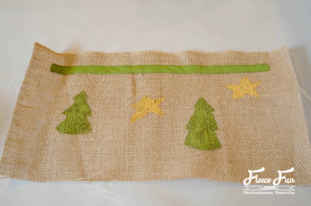 Sewing the bias tape. Gifting just got a glow-up. With this simple mason jar cover tutorial, you can turn any treat, mix, or cocoa into a thoughtful handmade gift. It’s all about the details—and this burlap wrap adds that cozy, homespun charm everyone loves. Follow the free tutorial and wrap your jars in something special this holiday.