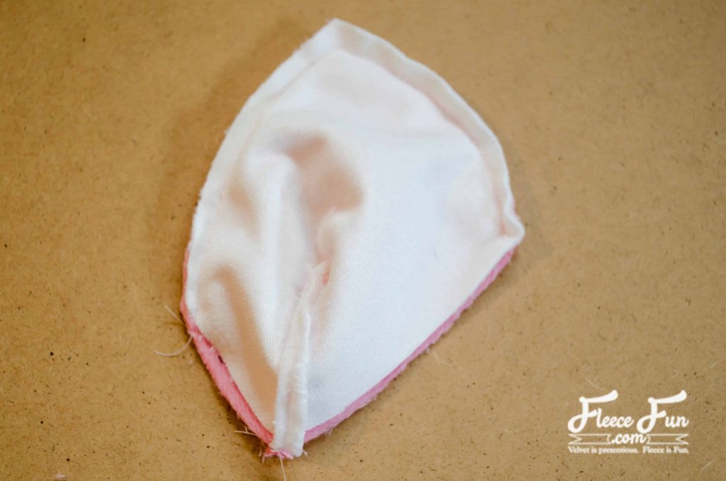 sewing the pink and white pieces.