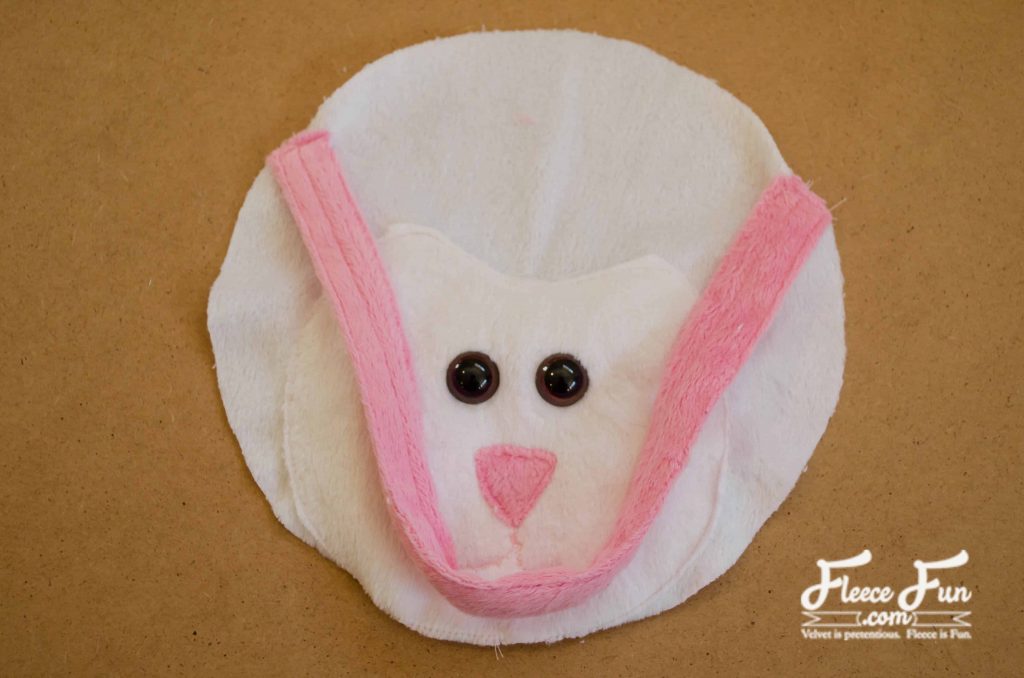 attaching the handles to the face. I love this fleecy sheep purse pattern and tutorial. Such a great handmade gift DIY idea and perfect sewing for a little girl.