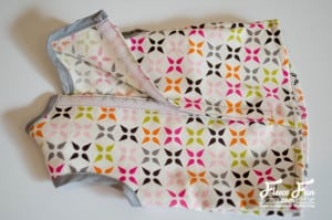 Follow fleecefun’s free template and tutorial to attach Velcro and finish the button tunic