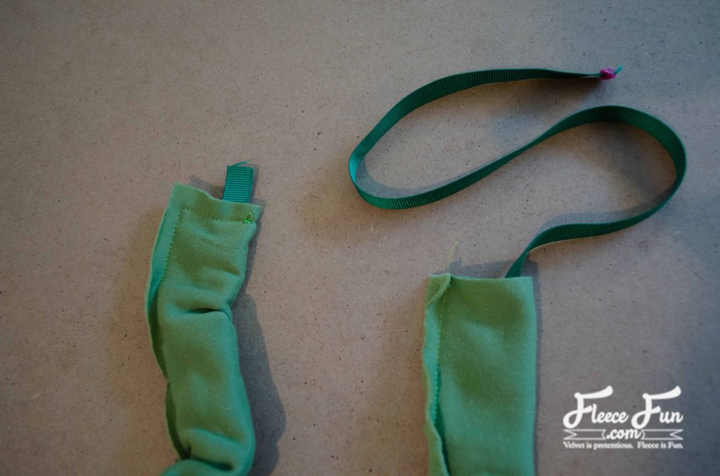 Sewing across the top of the tube. You don’t need knitting needles to rock the braided headband trend this fall. With just some fleece and a sewing machine, you can whip up this cozy braided fleece ear warmer in no time. This free step-by-step tutorial walks you through the whole thing—no crochet, no stress, just soft, toasty style. Your ears will thank you.