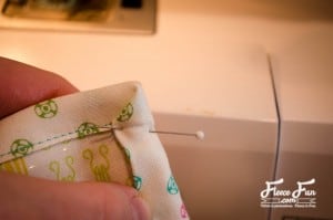 folding the binding.I love this Craft room hanging organizer. The sewing instructions are clear and easy to follow. I think I will make it in the colors to go with my sewing space. Great DIY.
