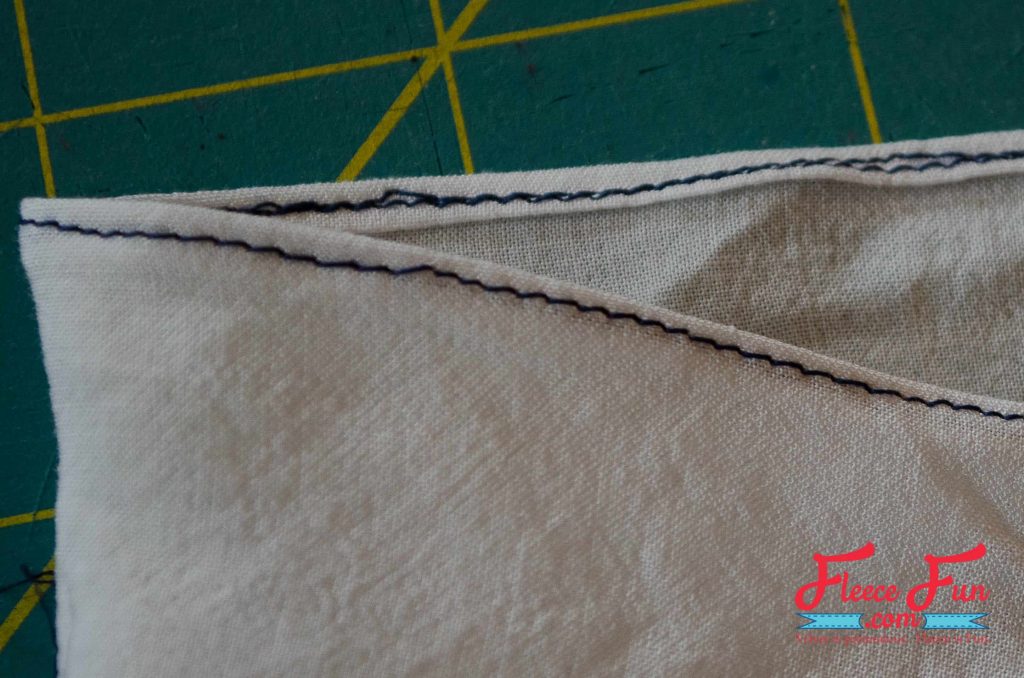 Finishing the stitch. This hand stamped scarf tutorial shows you how to turn a blank scarf into a statement piece—no fancy tools needed. With just a stamp, some paint, and a little time, you’ll end up with a one-of-a-kind accessory that’s uniquely you. It’s simple, fun, and makes the perfect handmade gift.