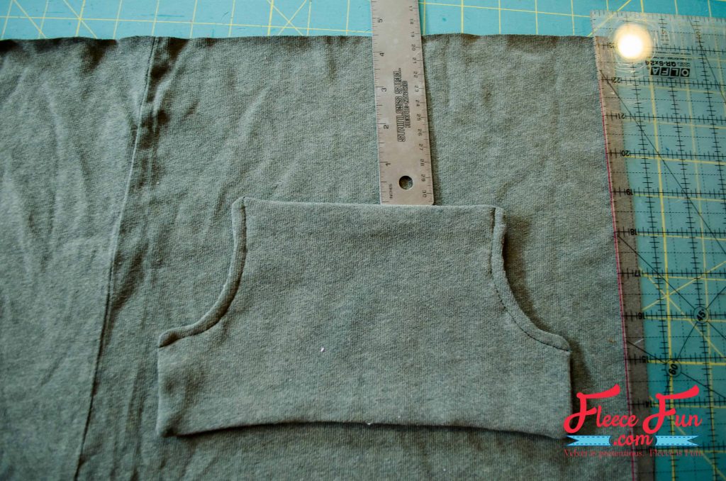 Step 3 of upcycled sweater skirt: attaching the pocket with free fleecefun guide