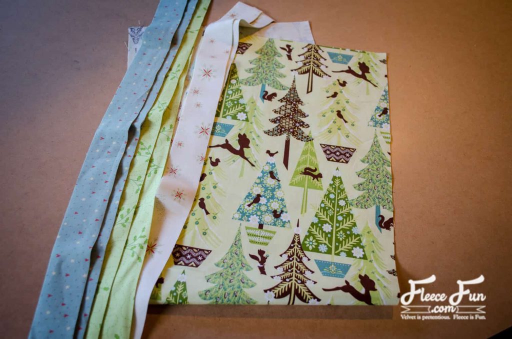 Cutting fabric pieces for a quilted Christmas table runner using fleecefun free template and tutorial