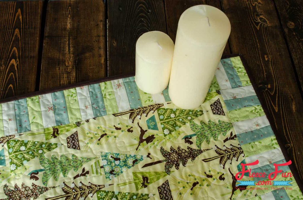 Close-up of a handmade quilted Christmas table runner crafted with fleecefun free sewing tutorial