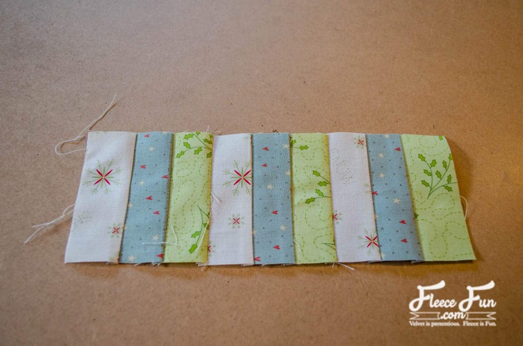 Attaching and assembling the border fabric for a DIY quilted Christmas table runner using fleecefun instructions