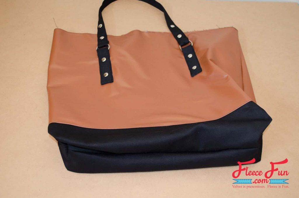 putting the tote bag pieces all together. This Leather Tote Bag is giving “I made this” energy. I wanted something sturdy enough for books, groceries, and weekend trips—but cute enough to gift. This leather-look tote checks all the boxes. It’s lined with a fun acorn print, stitched in faux leather, and honestly feels store-bought. Made with free step by step tutorial at FleeceFun.com