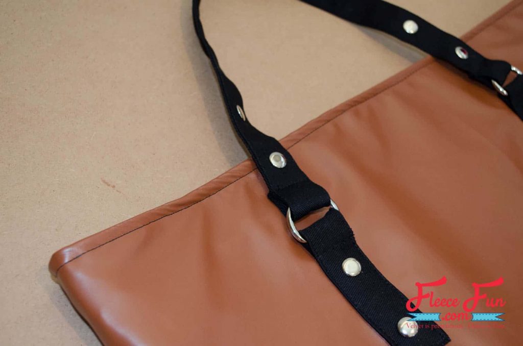 completed leather tote bag. This tote is giving “I made this” energy. I wanted something sturdy enough for books, groceries, and weekend trips—but cute enough to gift. This leather-look tote checks all the boxes. It’s lined with a fun acorn print, stitched in faux leather, and honestly feels store-bought. Made with free step by step tutorial at FleeceFun.com