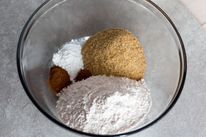 Mixing the dry ingredients. Enjoy Cinnamon Apple Scones with this free recipe, a cozy autumn treat perfect for breakfast, brunch, or sharing warm with friends.