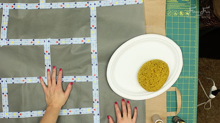 painting the castle walls. Wow I love this play castle tutorial. Such a great DIY idea for play for kids. Love how it fits onto a card table and folds into a bag when play is done!