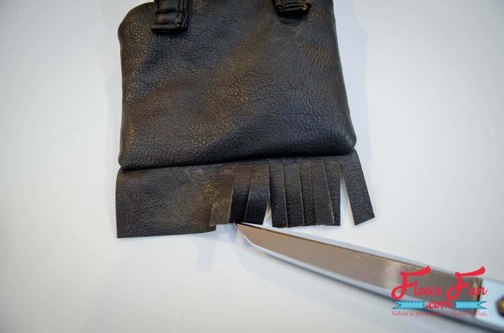 Completing the final touches on the lined leather fringe purse from fleecefun’s pattern