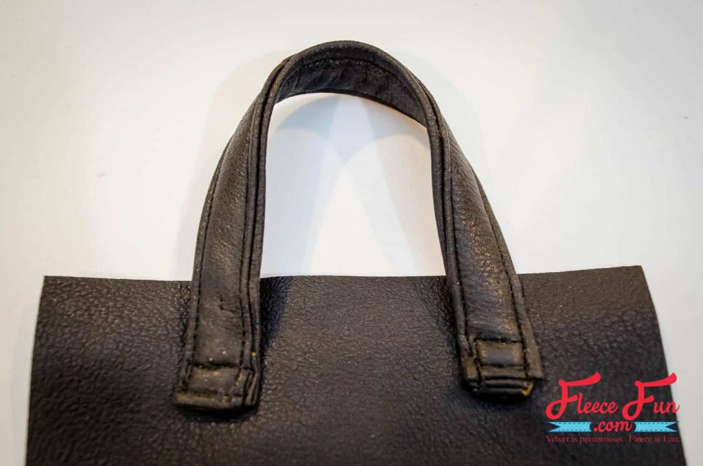 Attaching the purse strap to the leather fringe bag with fleecefun’s free tutorial