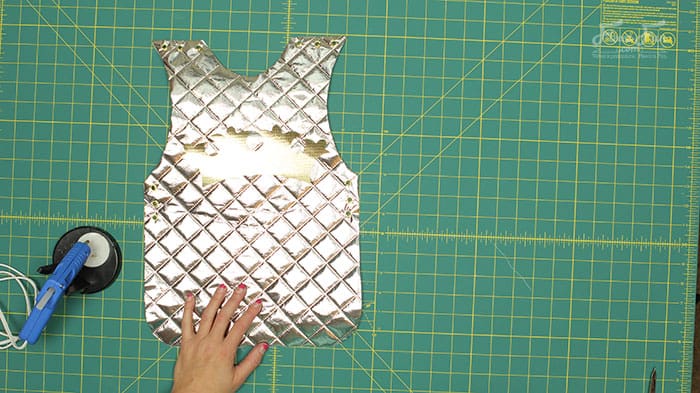 gluing on the decorations for the costume. This no-sew knight costume is the ultimate quick-and-easy DIY for your little warrior. With just a few simple materials, free PDF pattern and step by step tutorial, you can create an epic tunic and armor fit for any young knight. Perfect for Halloween, school plays, or just an afternoon of backyard battles.