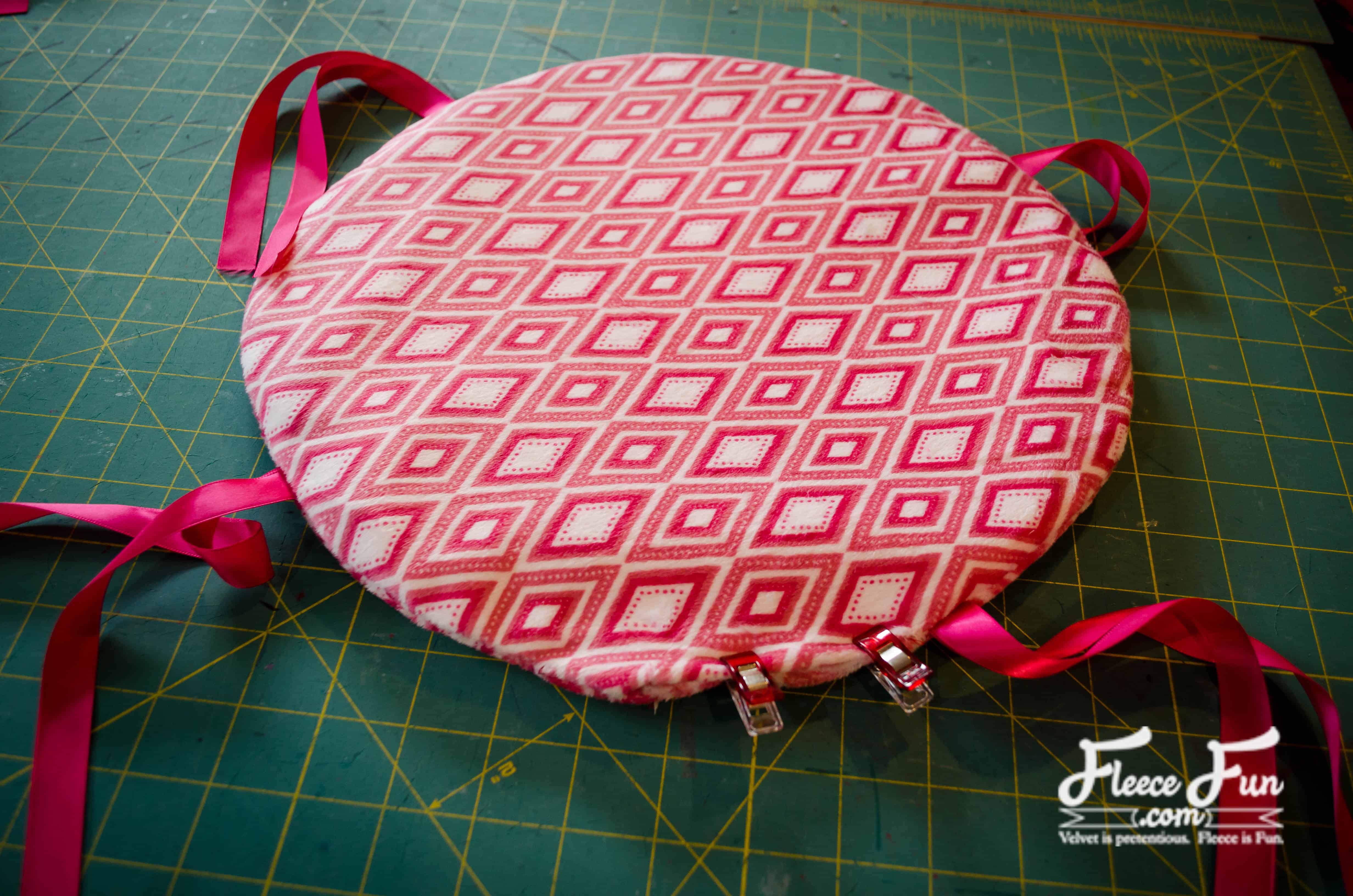 sewing the button in place