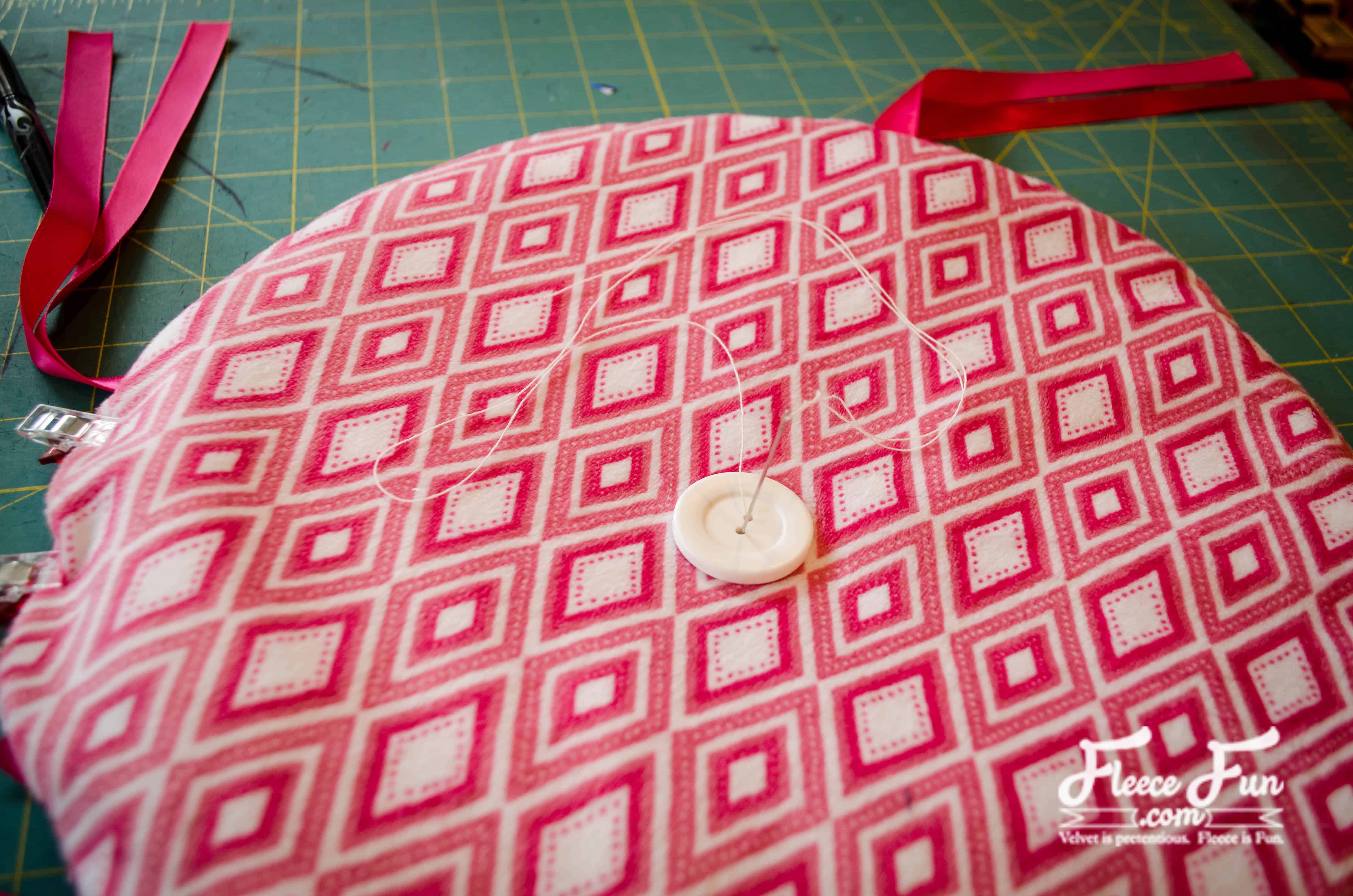 Finishing touches on a handmade Ikea stool cushion – fleecefun free tutorial