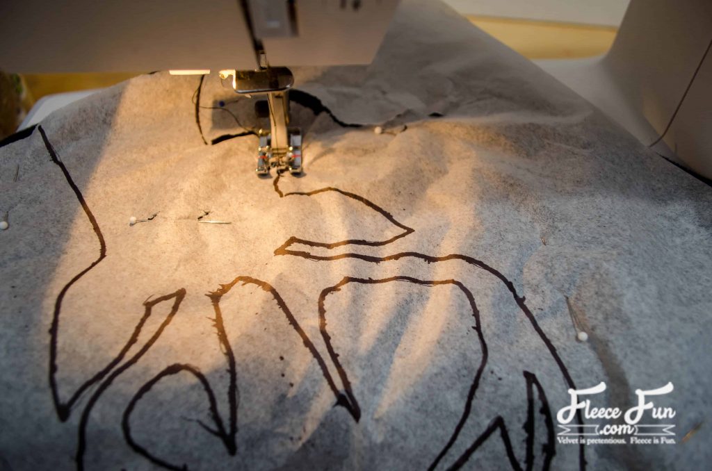 Tracing the deer head design for the pillow with fleecefun and free template