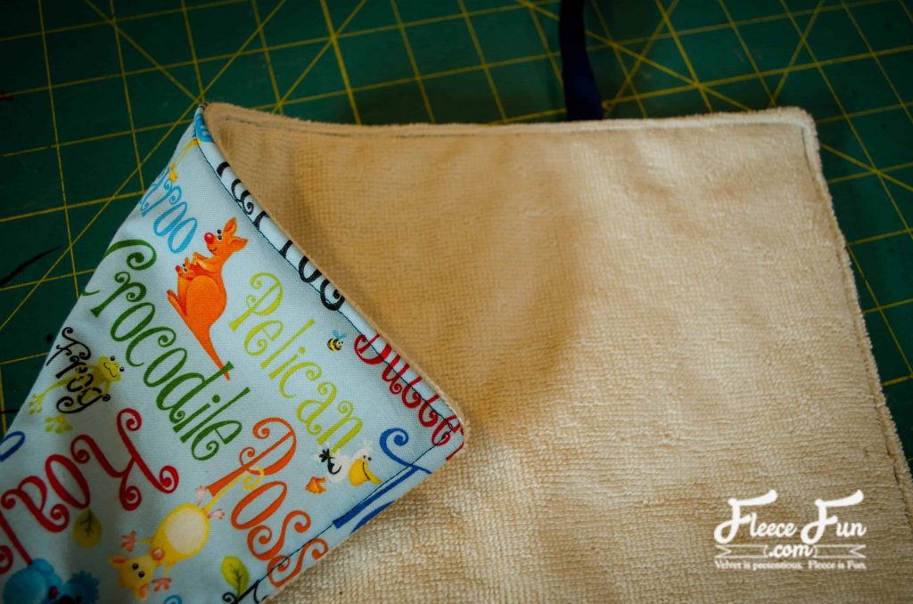 sewing the perimeter of the mat. I love this sewing project for babies. This diaper changing mat is simple to make and the perfect addition to any diaper bag or purse! fleece fun waterproof change mat tutorial