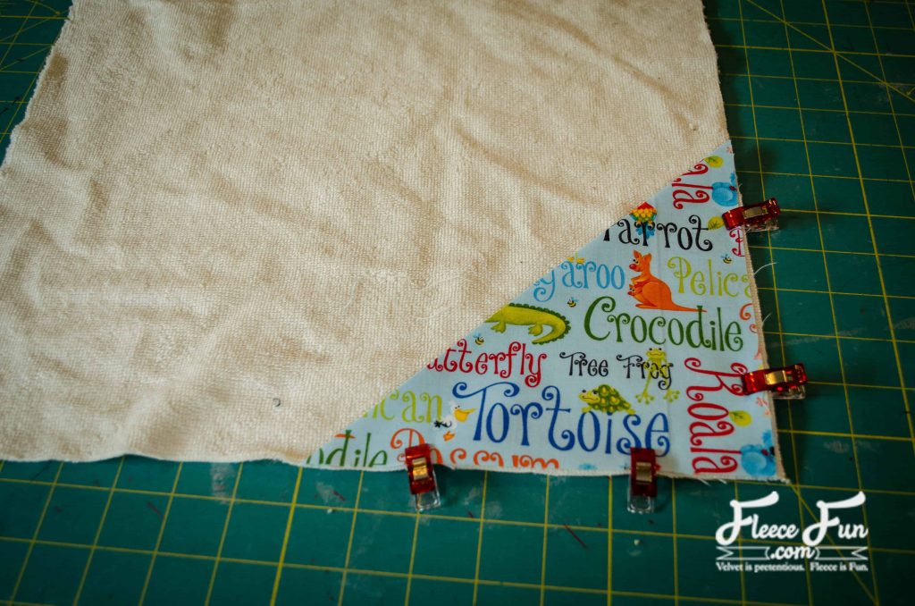 pinning the corner pocket. I love this sewing project for babies. This diaper changing mat is simple to make and the perfect addition to any diaper bag or purse! fleece fun waterproof change mat tutorial