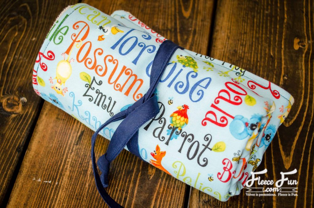 Finished Changing Mat. I love this sewing project for babies. This diaper changing mat is simple to make and the perfect addition to any diaper bag or purse! fleece fun waterproof change mat tutorial