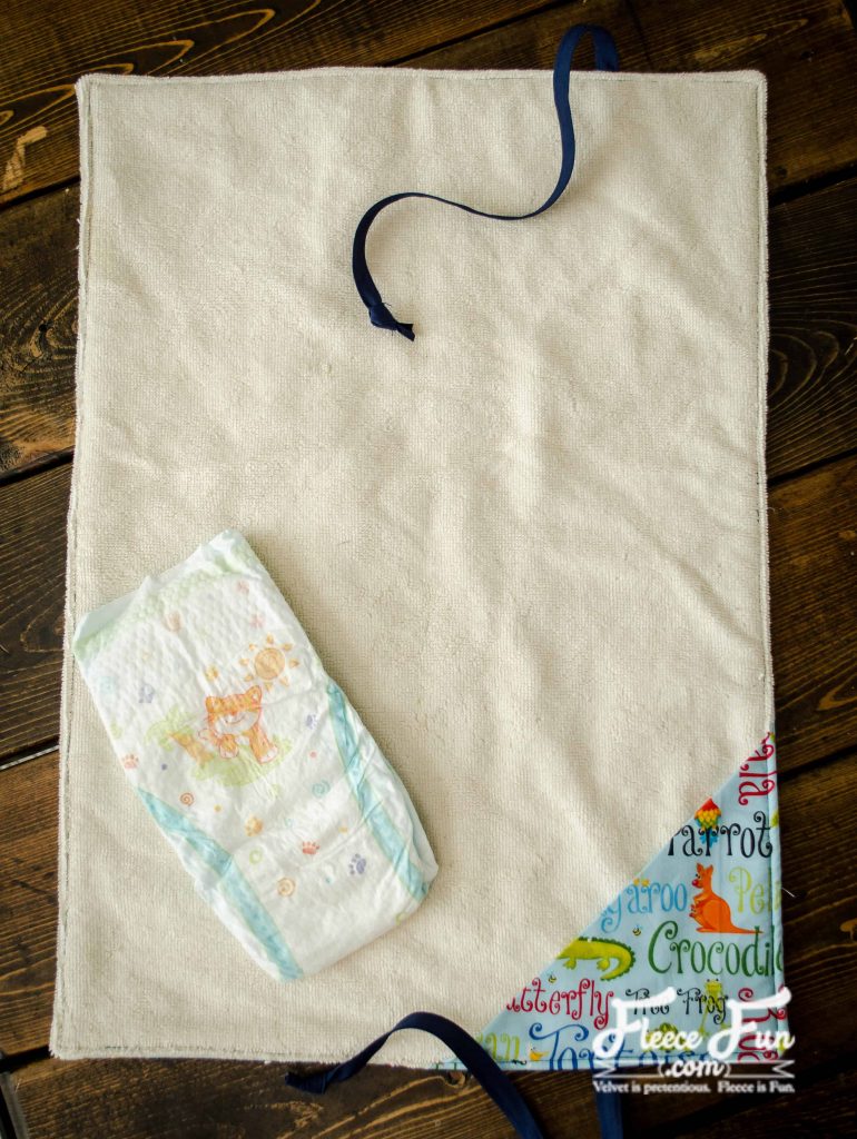 Unrolled changing mat. I love this sewing project for babies. This diaper changing mat is simple to make and the perfect addition to any diaper bag or purse! fleece fun waterproof change mat tutorial