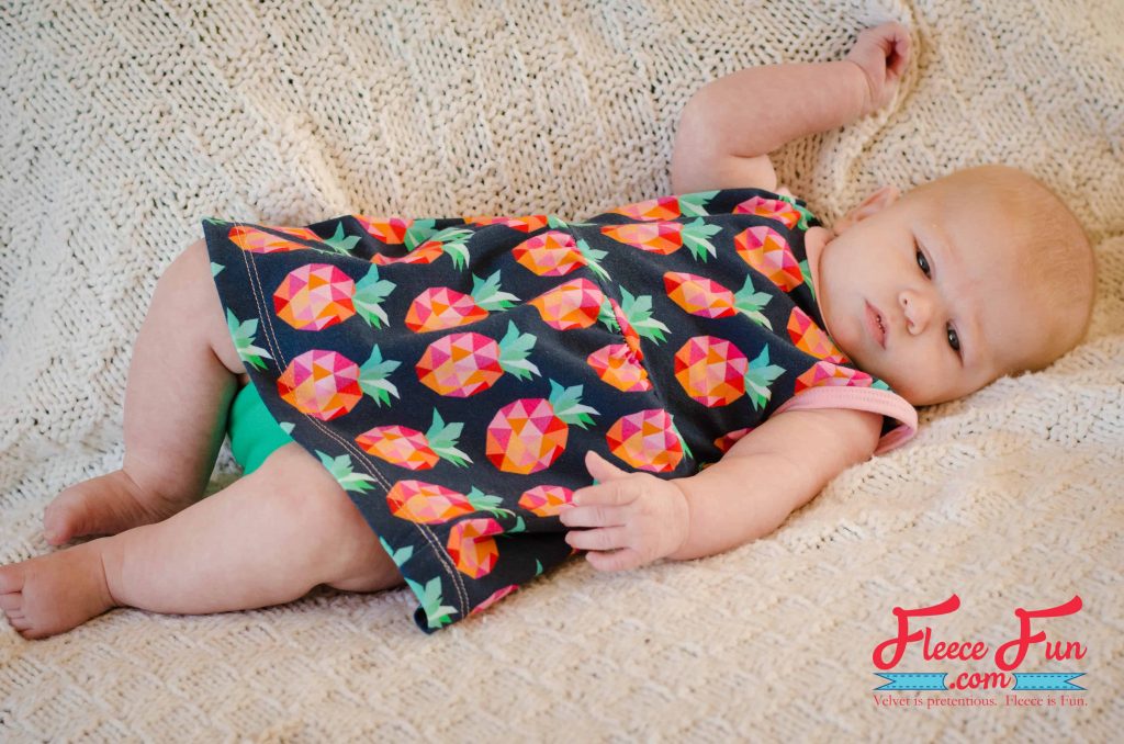DIY baby sundress in bright floral fabric made with fleecefun free template and tutorial