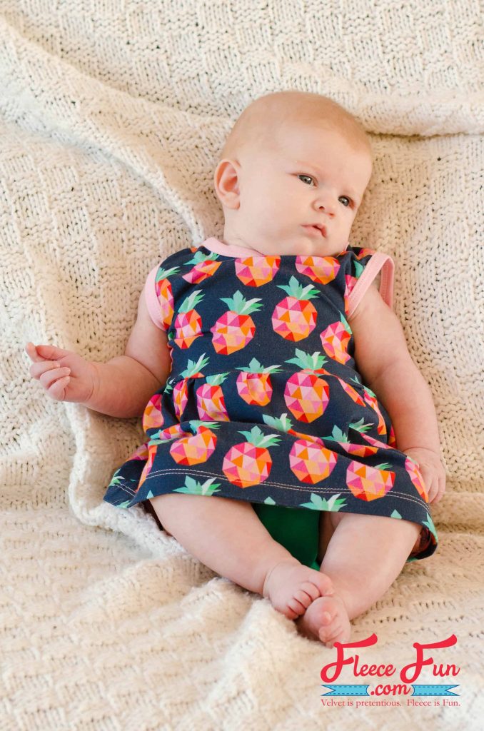 DIY baby sundress in bright floral fabric made with fleecefun free template and tutorial