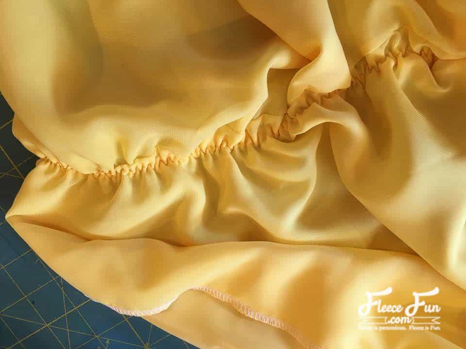 close up of the sewn elastic. This easy to make Belle Costume is fast and perfect for you little one. Beginner friendly it's perfect for Halloween. Great Sewing Project DIY. Belle Costume Tutorial Beauty and the Beast