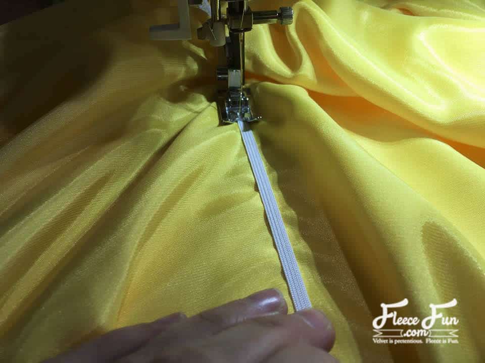 sewing the elastic on the skirt