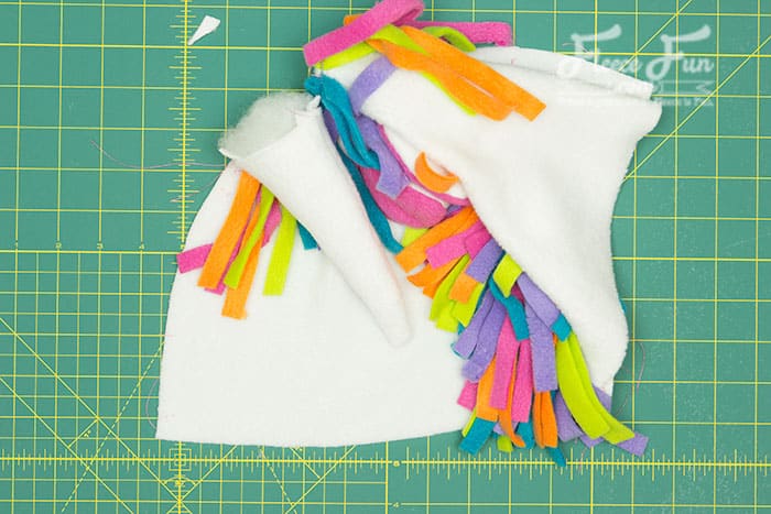 Attaching the unicorn horn to the fleece hat, using FleeceFun's free pattern