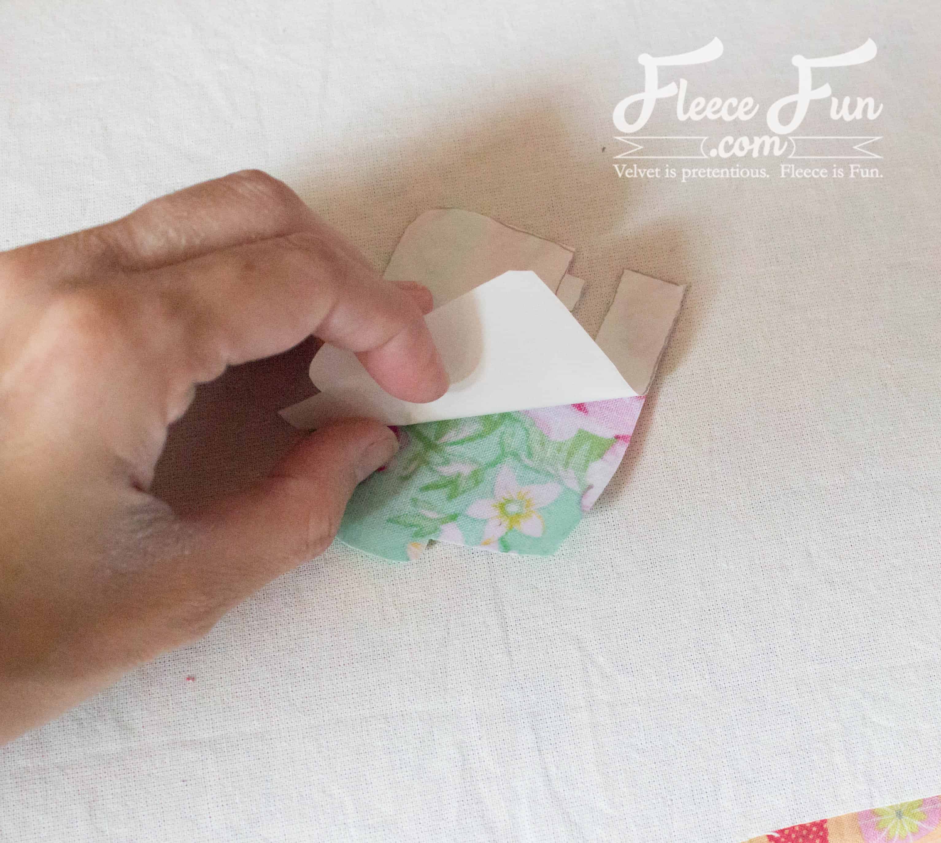 peeling off the backing. I love this Sewing Machine Hoop Art Tutorial. wonderful sewing project and handmade gift ideas for friends. This is perfect for a sewist's wall and sewing studio.