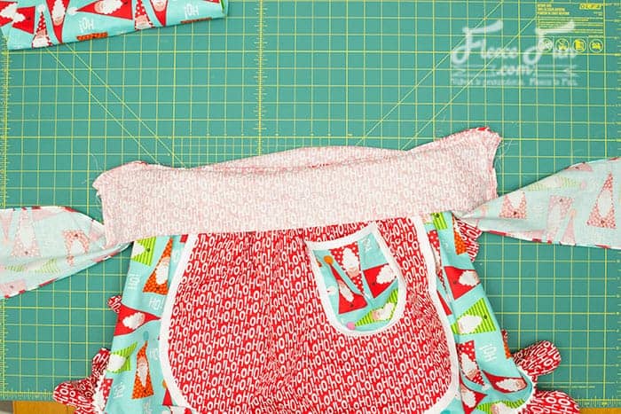 Stitching the final pieces of a retro apron with fleecefun’s free template and tutorial.