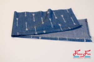 Finishing one long edge. This free pattern shows you how to sew a sweet chambray party dress for your 18″ doll. It’s the kind of dress that works for any occasion—casual with boots and a cardigan, fancy with a bolero and shiny shoes. With clear steps and simple sewing, you’ll have dolly dressed to impress before the party starts.