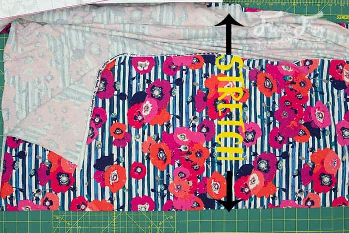 Aligning and pinning pattern pieces for a pink midi skirt with fleecefun free template and tutorial