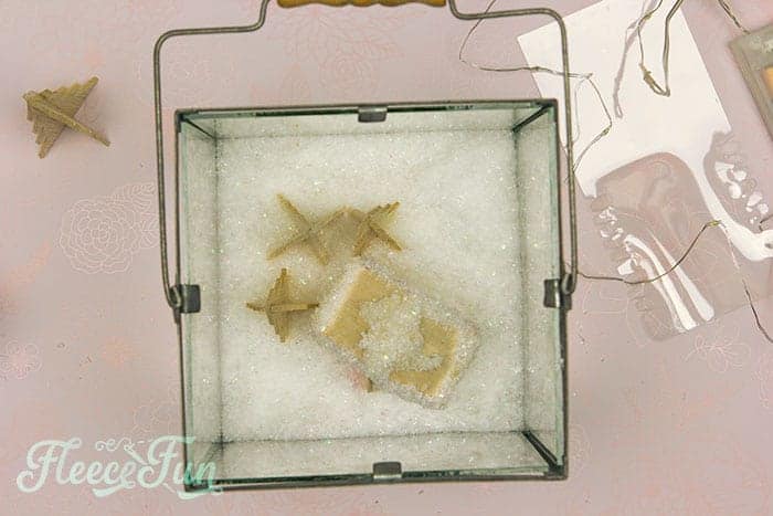 Step 7 of fleecefun's guide: assembling the final pieces of your festive Christmas terrarium.